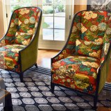 F14. Pair of upholstered wing back chairs with dragon fabric upholstery. 48”h x 28”w x 36”d 